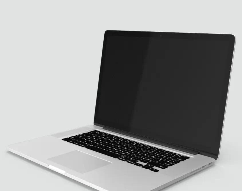 Srebrny laptop, który nawiązuje do prowadzenia biznesu online.